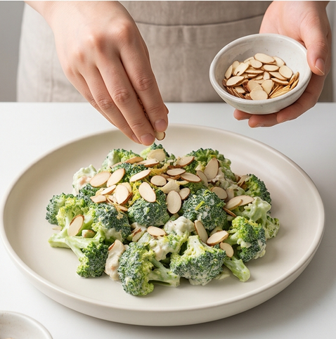 브로콜리 두부 크림드 샐러드 | 단백질과 칼슘 한번에 챙기기 조리 단계 5 이미지 - 접시에 샐러드를 담고 아몬드 슬라이스를 고르게 뿌린다.